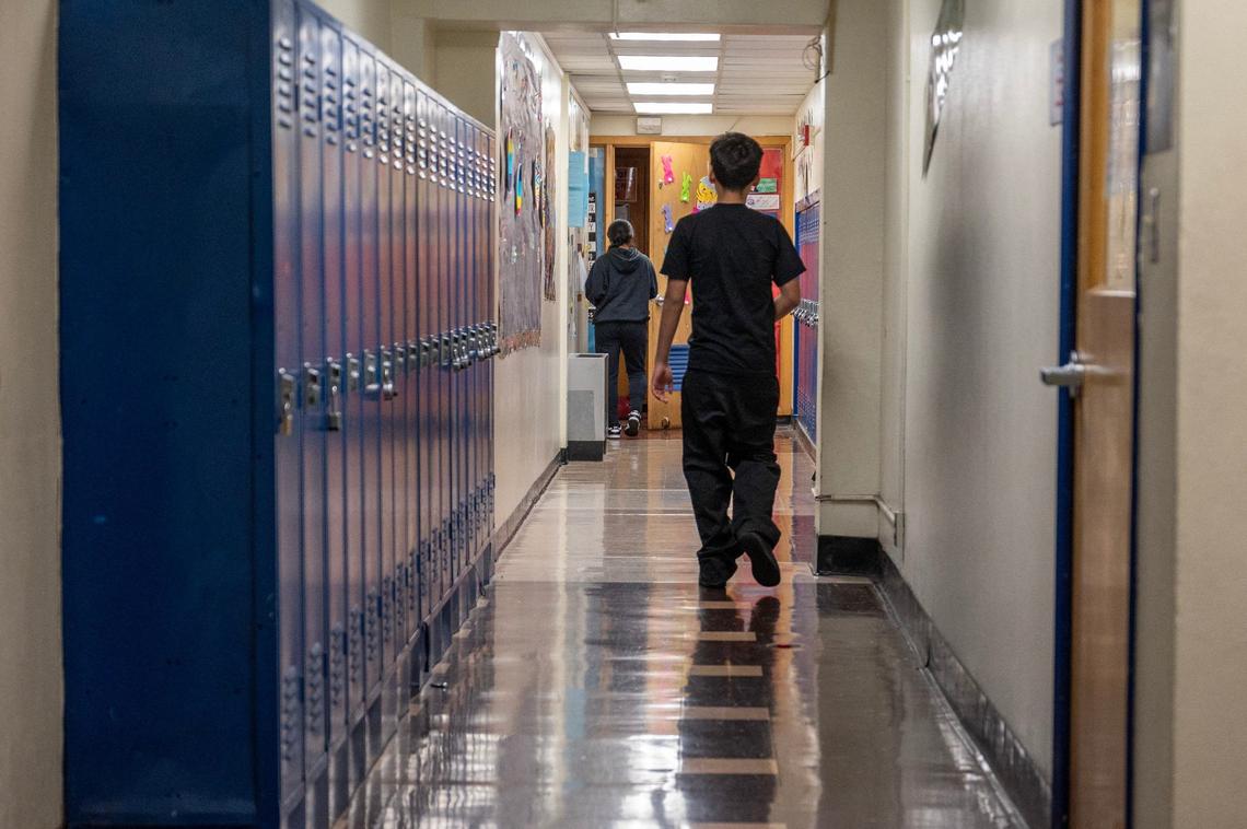 Students walk down a hall at Central Middle School on Tuesday, April 16, 2024, in Kansas City, Kansas.