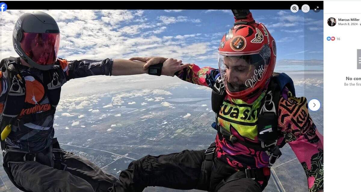 Marcus Miller, right, skydiving in his red helmet.