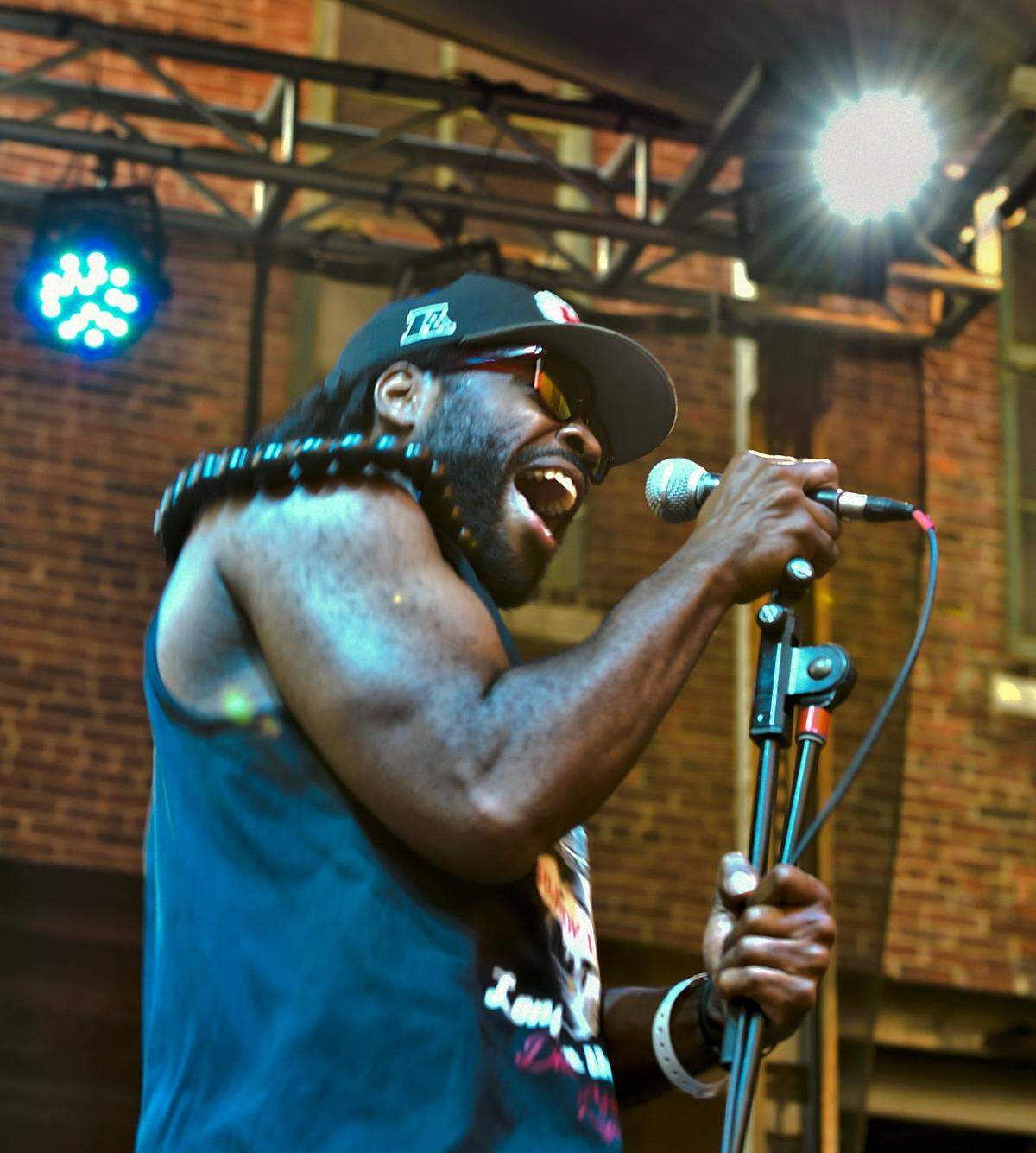 Lez Izmore, a singer and percussionist with Hearts of Darkness, performs during the Boulevardia festival in Kansas City's West Bottoms on Friday, June 13, 2014.