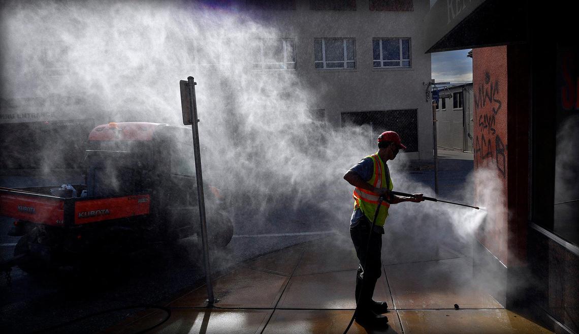 Cleaning crews were busy Monday morning on the Country Club Plaza, removing graffiti from buildings and picking up trash after a weekend of protests over the death of George Floyd.