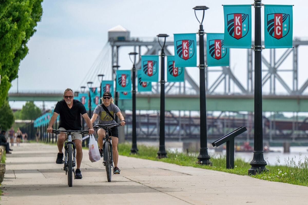 Cyclists ride along the Berkley Riverfront.