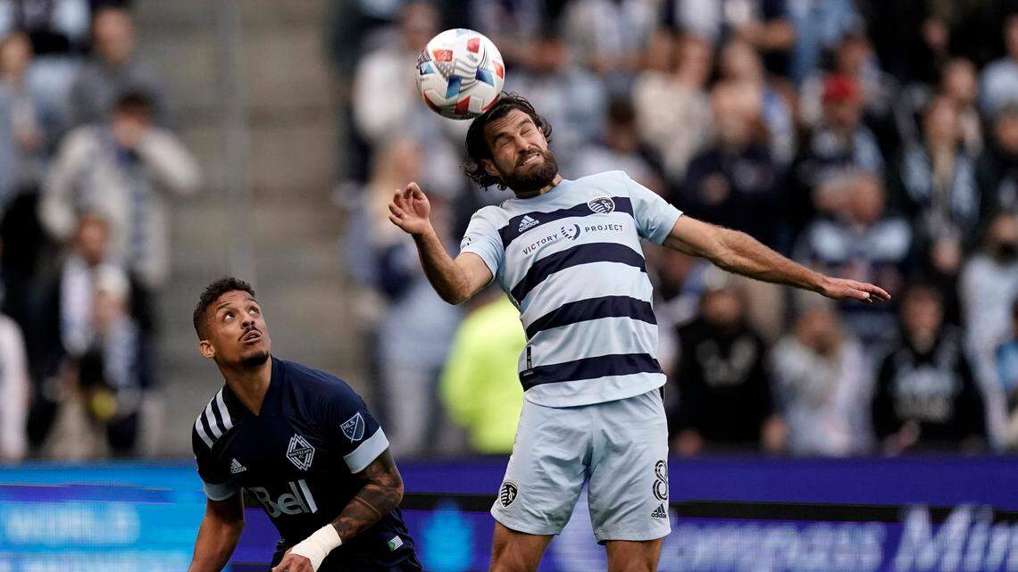 Sporting Kansas City midfielder Graham Zusi (8) heads the ball during Saturday’s MLS playoff opener against Vancouver and Children’s Mercy Park.