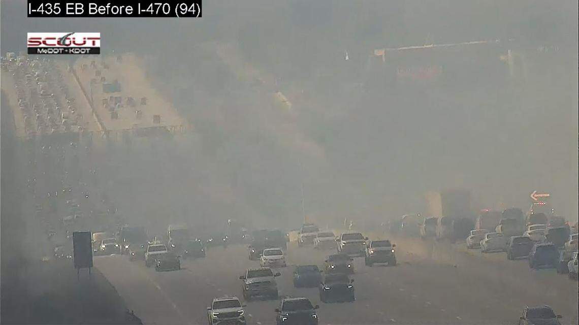 Thick black smoke billowing from a large grass fire cut visibility along Interstate 435 near Blue River Road on Kansas City’s south side, Kansas City Scout traffic cameras showed, The Kansas City Fire Department was advising drivers to avoid the area or plan for delays as traffic was backing up near the blaze.