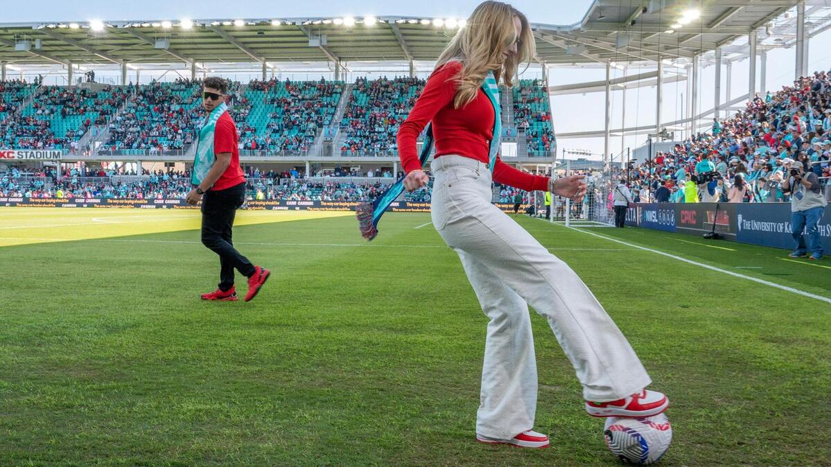 KC Current co-owners Brittany Mahomes and Patrick Mahomes pass a soccer ball around on the pitch before an NWSL game against the Portland Thorns FC at CPKC Stadium on Saturday, March 16, 2024, in Kansas City.