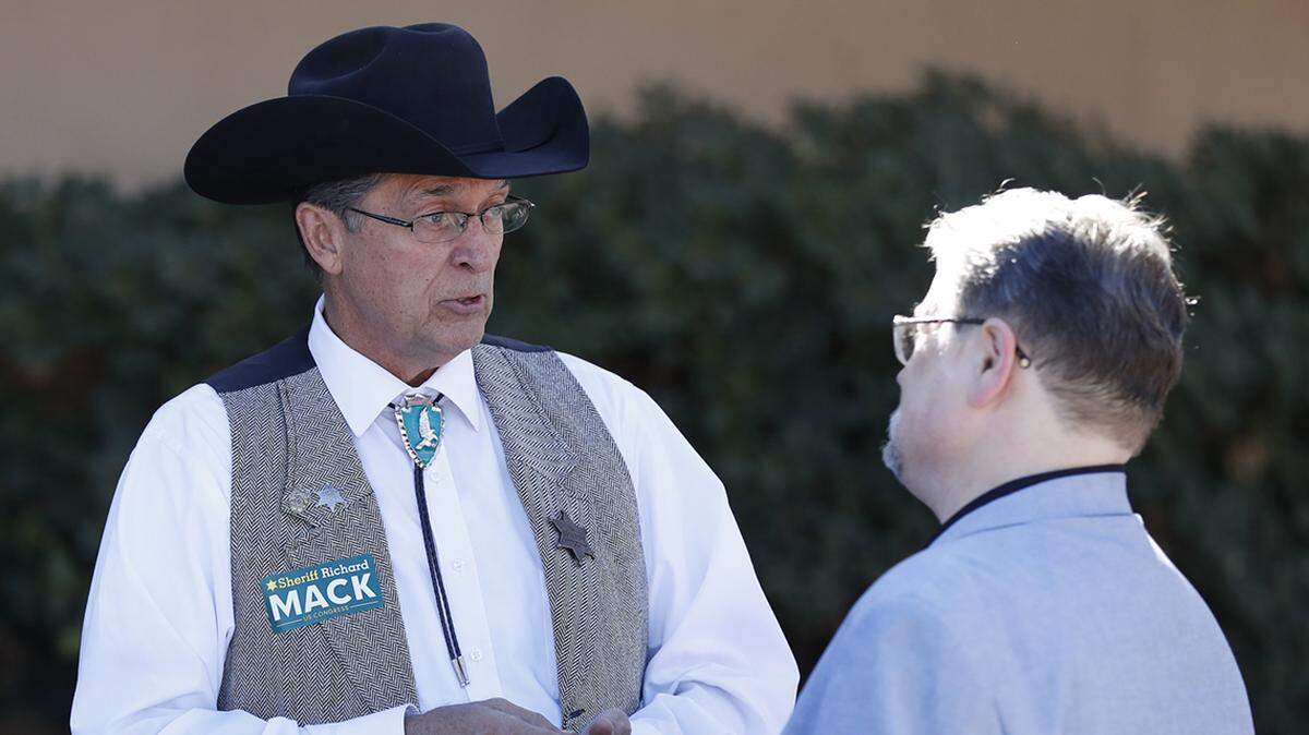 Richard Mack, left, and his so-called Constitutional Sheriffs and Peace Officers Association are steeped in racist Christian Identity theology.