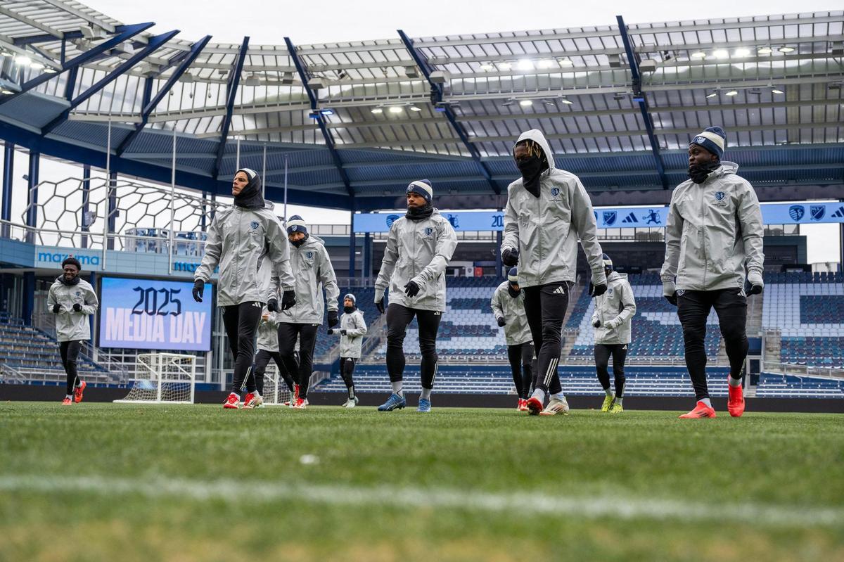 Sporting Kansas City players, bundled up against the cold, go through drills during practice at Children’s Mercy Park on Friday, Feb. 14, 2025, in Kansas City, Kansas.