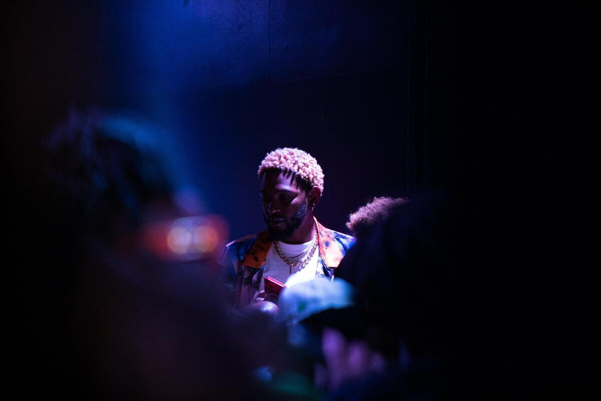 Taylor Fosters looks on as a contestant of the Pride Ball enters the dance floor at Uptown Theater on June 9, 2023, in Kansas City. The Pride Ball initiated the start of the Kansas City Pride activities over the weekend.