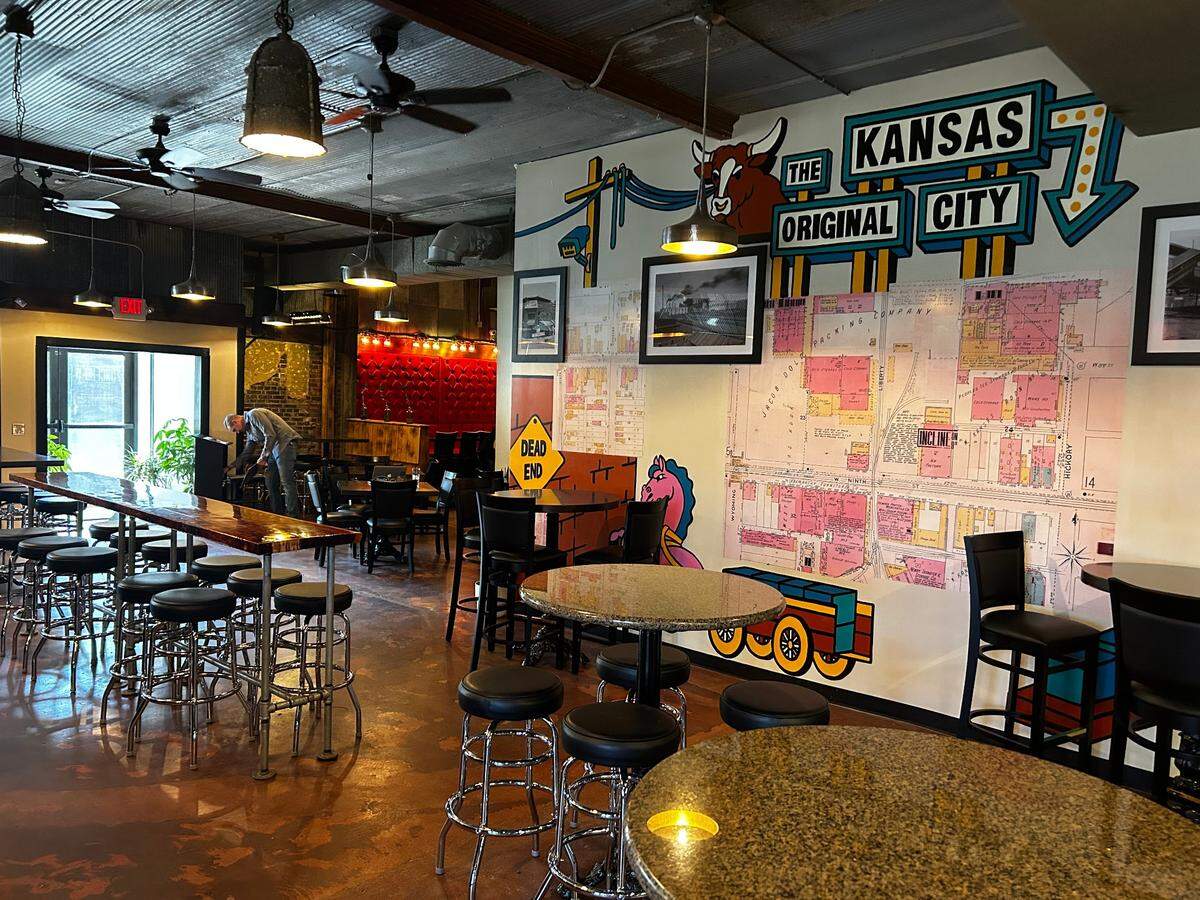 A wall inside Incline on 9th is decorated with photographs and old land surveys that owner P.J. Purtle found in the Kansas City Public Library’s Missouri Valley Special Collections Room.