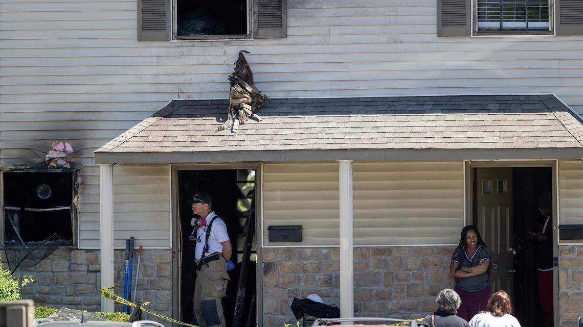Overland Park firefighters investigate an early-morning apartment fire at Sheridan Ridge Apartments in the 8300 block of Farley Street on Saturday, April 18, 2026. Five people, two adults and three children, were taken to the hospital. One adult and three children were listed in critical condition, while the second adult was believed to have less serious injuries, according to the Overland Park Fire Department.