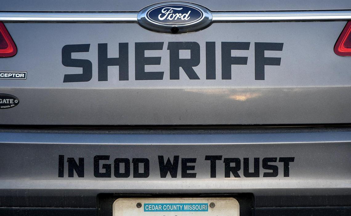 A Cedar County, Missouri, sheriff’s vehicle bears the message “In God we trust.” The Star has found close ties between Agape and law enforcement in Cedar County.