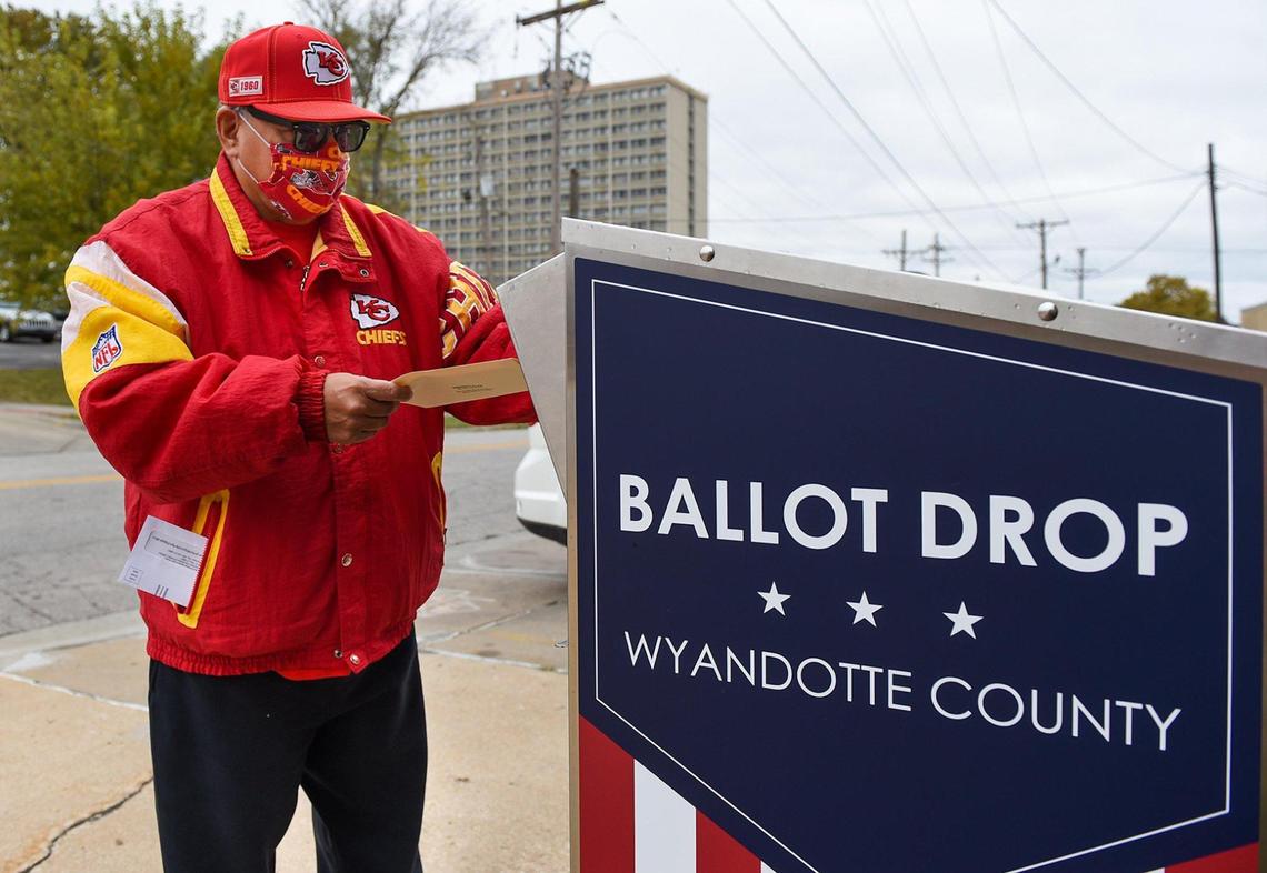 Wyandotte County voters including Joseph Valdivia Jr., of Kansas City, Kansas, returned his mail-in ballot Friday, Oct. 23, 2020, in a ballot drop box outside the Wyandotte County Election office, 850 State Ave. Voters have already returned more than one third of the requested mail-in ballots.