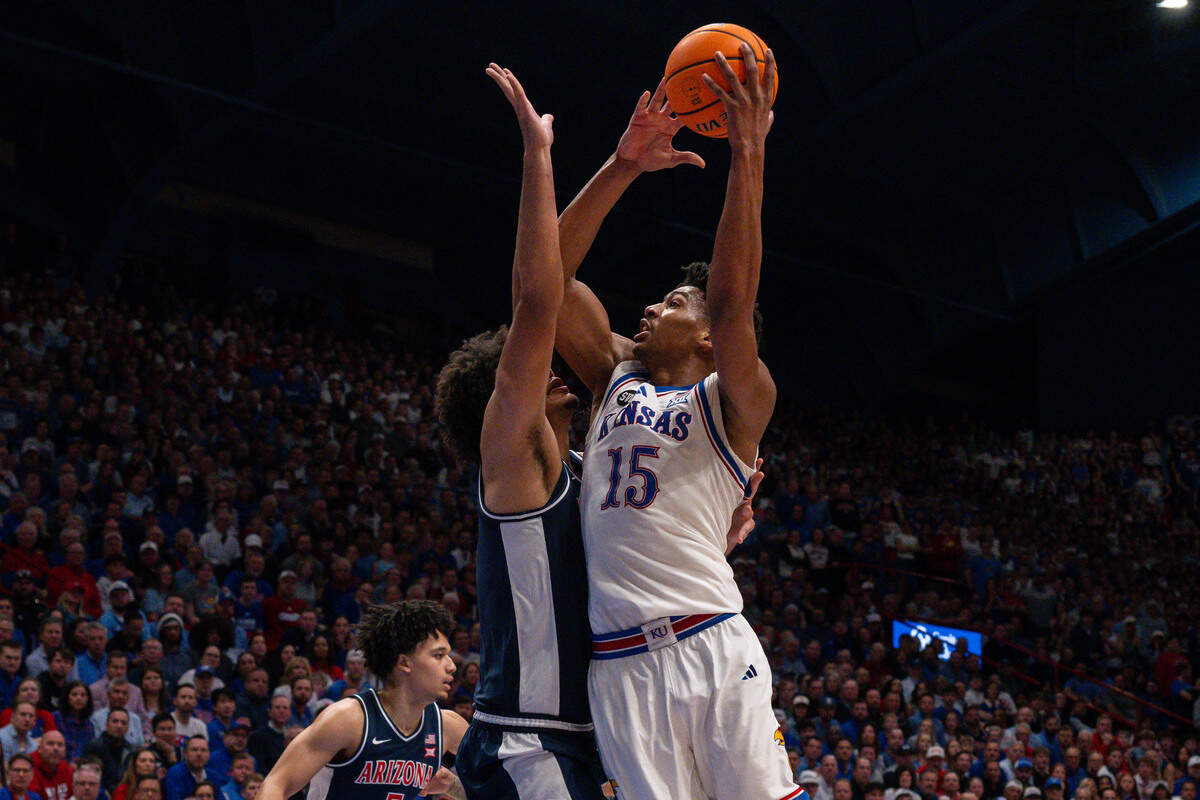 Kansas Jayhawks forward Bryson Tiller (15) shoots a jumper over an Arizona Wildcats defender in the first half of the Jayhawks game vs. the Arizona Wildcats on Monday, Feb. 9, at Allen Fieldhouse.