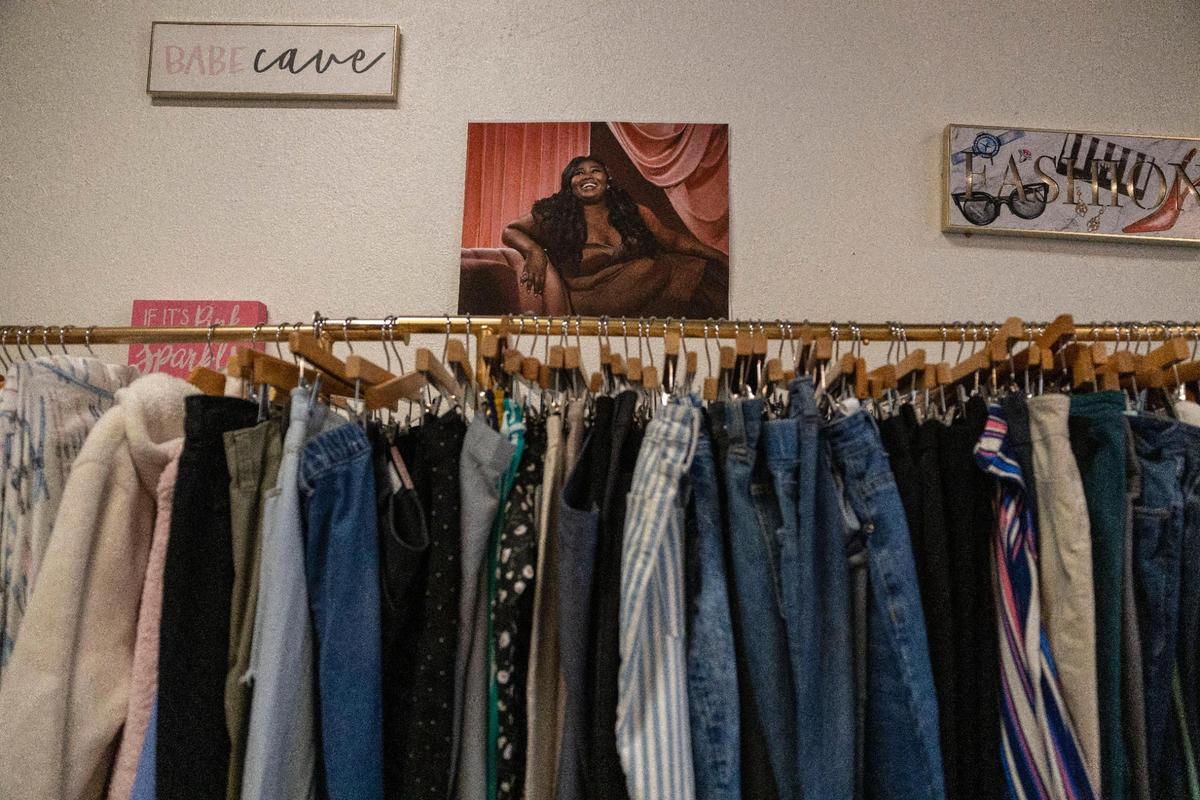 Pants, jeans and other clothing items hang on a rack at Unleshed+ on Troost Avenue.