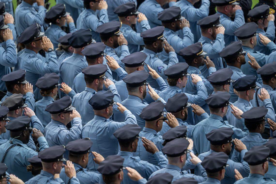 First responders salute during the memorial service for Deputy Elijah Ming at Children's Mercy Park on Monday, Aug. 11, 2025, in Kansas City, Kansas.