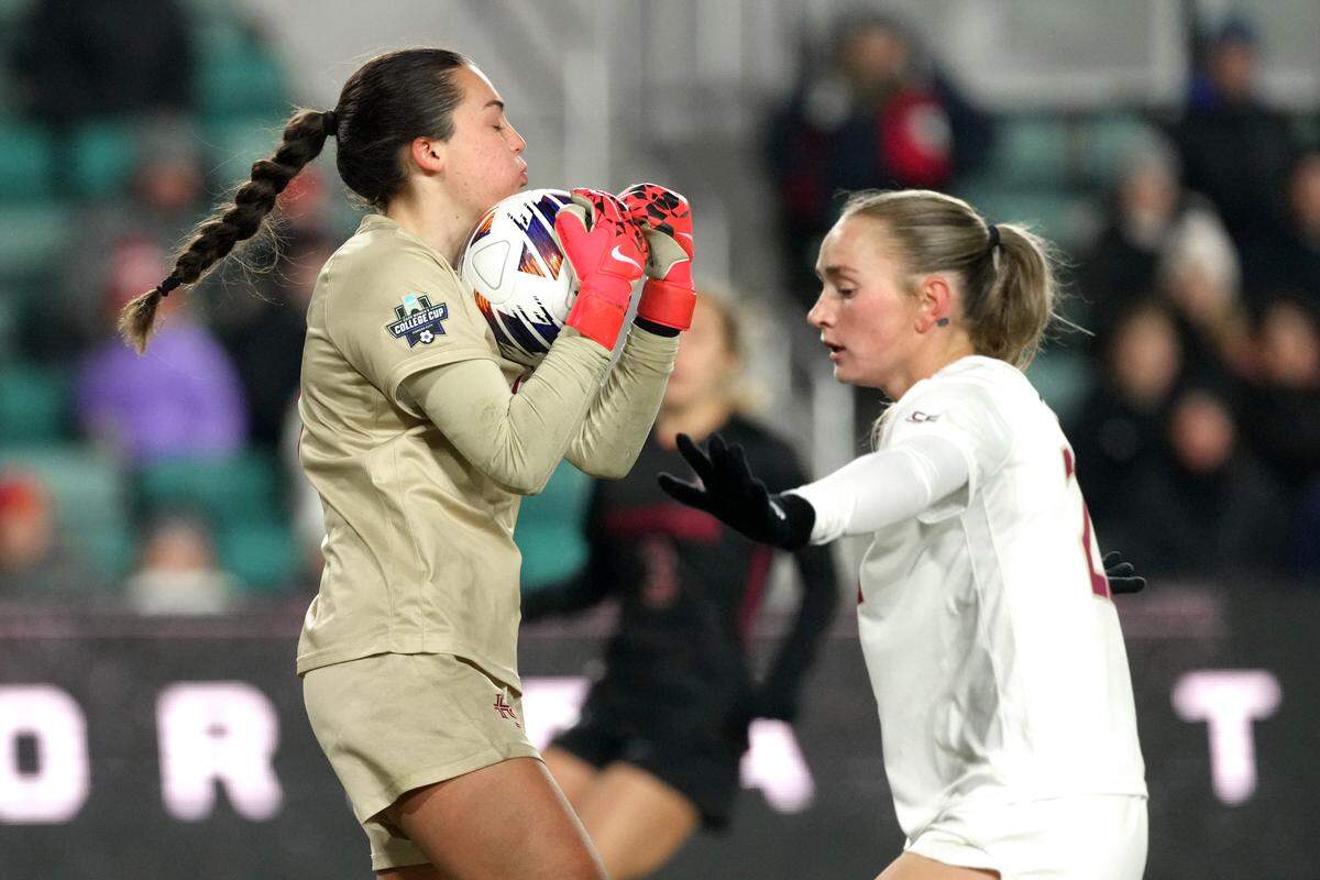 Goalkeeper Kate Ockene #18 of the Florida State Seminoles controls the ball in front of defender Heather Gilchrist #20 in the first half of the NCAA Division I Women’s Soccer Championship match against the Stanford Cardinal at CPKC Stadium on December 8, 2025, in Kansas City.
