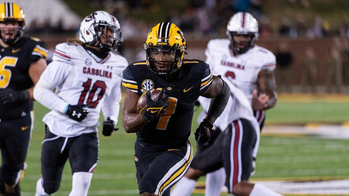 Missouri running back Tyler Badie scores a touchdown against South Carolina during the fourth quarter on Saturday, Nov. 13, 2021, in Columbia, Mo. Missouri won 31-28.