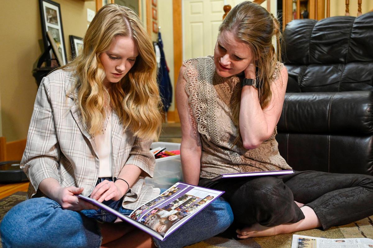 Haylee Weissenbach and her mother, Jenny Weissenbach, look over her yearbook from when she was one of the valedictorians in the Class of 2019 at McLouth High School in McLouth, Kansas.