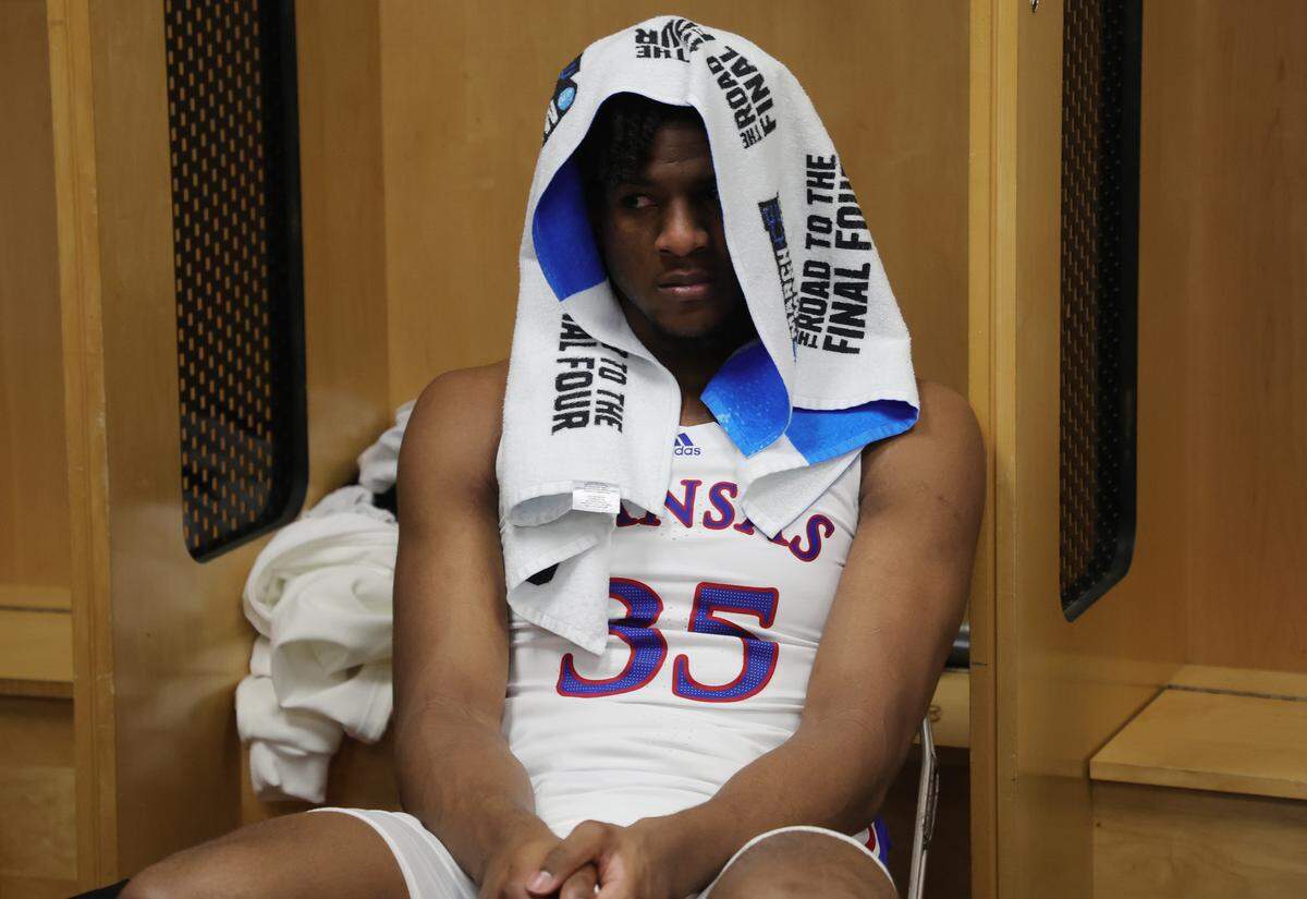 Zuby Ejiofor #35 of the Kansas Jayhawks reacts in the locker room after being defeated by the Arkansas Razorbacks in the second round of the NCAA Men's Basketball Tournament at Wells Fargo Arena on March 18, 2023 in Des Moines, Iowa.