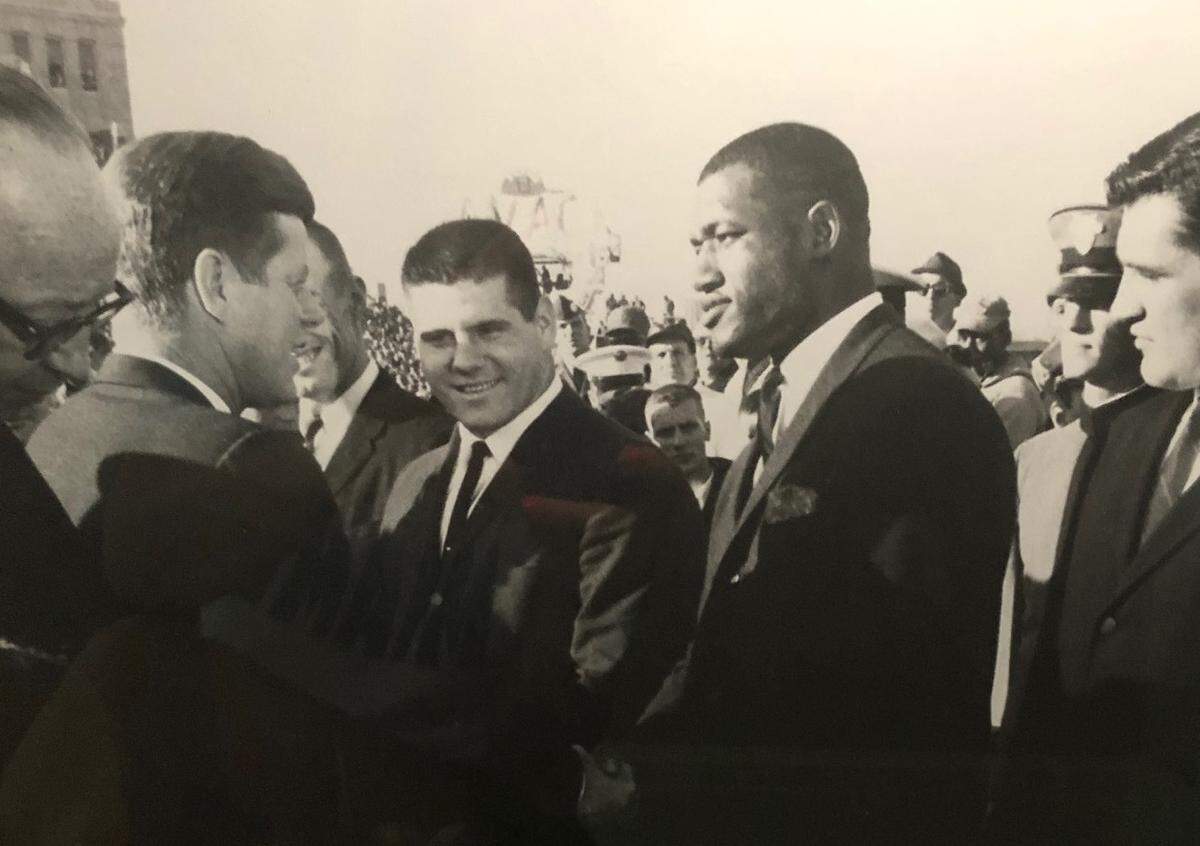 Chiefs legend Bobby Bell, right, meets President John F. Kennedy in 1959.