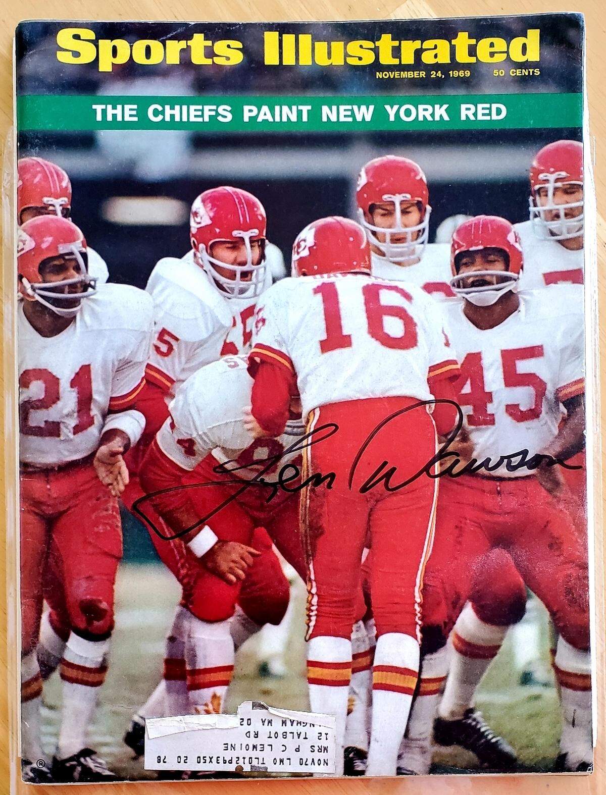 An autographed copy of a 1969 Sports Illustrated magazine, featuring the Kansas City Chiefs on the cover. The copy was signed by Chiefs quarterback Len Dawson.