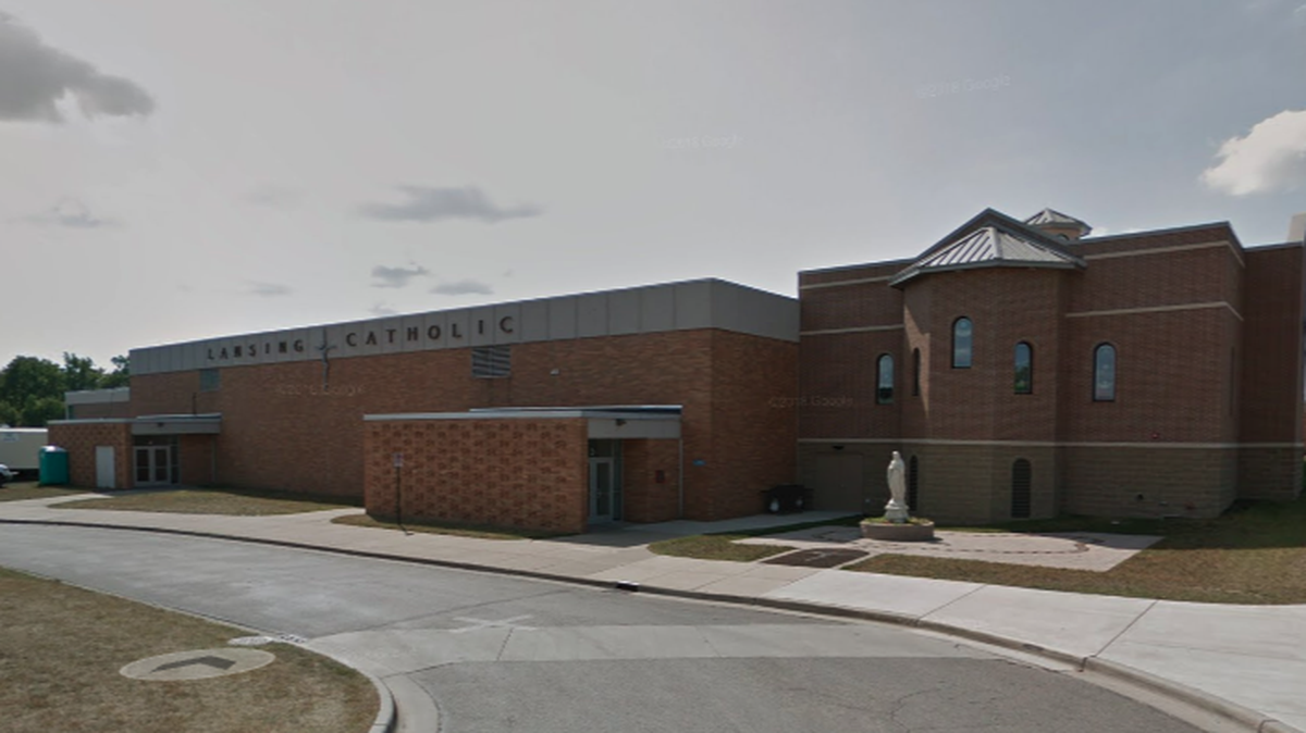 Lansing Catholic High School in Michigan shared a 1979 photo on social media Thursday of a student in a Ku Klux Klan outfit.