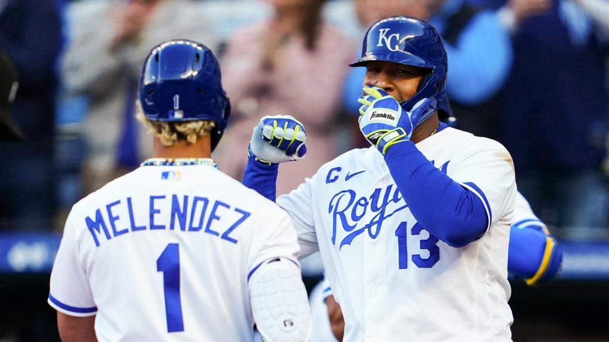 Kansas City Royals catcher Salvador Perez (13) congratulates right fielder MJ Melendez (1) after hitting a home run during the first inning against the Baltimore Orioles at Kauffman Stadium.