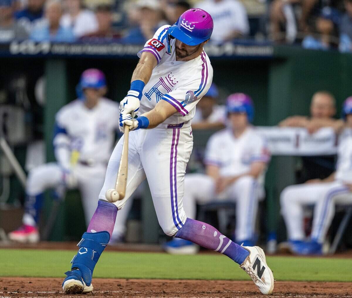 Wearing the Kansas City Royals' new "Forever Fountains" City Connect uniform, center fielder Kameron Misner (26) swings at a pitch for a strike in the first inning against the Houston Astros on Friday, June 12, 2026, at Kauffman Stadium in Kansas City.