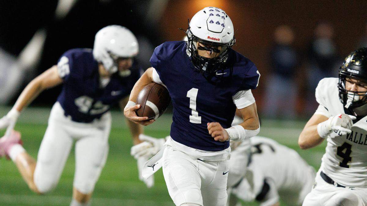 Quarterback Blake Jay runs for one of his three touchdowns during Mill Valley’s 35-26 high school football win over Blue Valley in the first round of the Kansas Class 5A playoffs on Friday, Oct. 31, 2025.