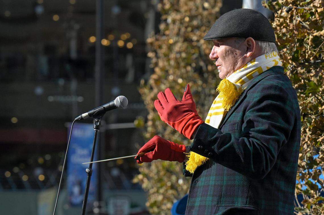 Scott Watson, professor of tuba-euphonium at the University of Kansas School of Music, directed hundreds of local tuba and euphonium players playing in the annual TubaChristmas holiday concert.