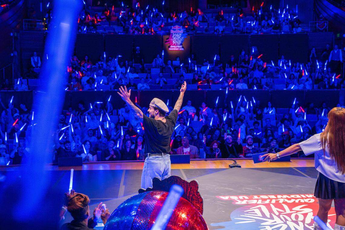 Jesse Sykes raises his arms to the crowd after they vote for him to advance past KC in the second round of the Red Bull Dance Your Style Midwest Regional Qualifier, on Saturday, April 25, 2026, at the Kauffman Center for the Performing Arts.