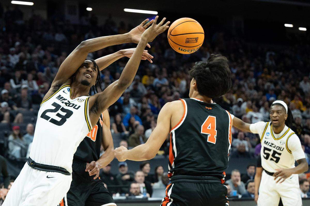 Missouri Tigers forward Aidan Shaw (23) loses control of the ball to Princeton Tigers guard Xaivian Lee (4) during a game in the NCAA Tournament at Golden 1 Center in Sacramento, Saturday, March 18, 2023. 3