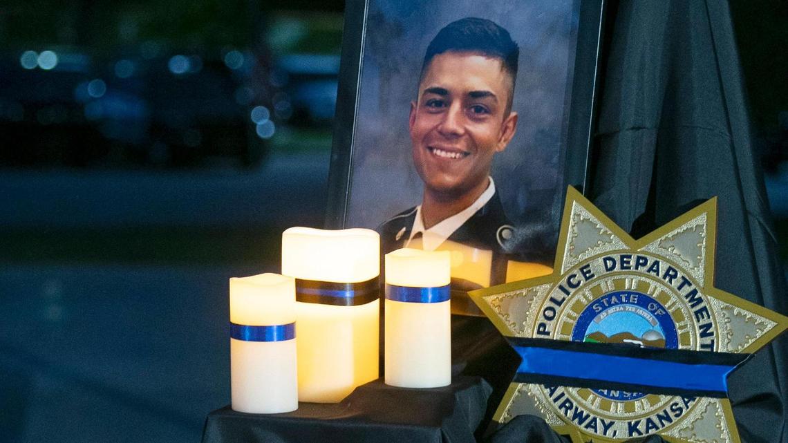 A photo of fallen Fairway police officer Jonah Oswald was displayed Saturday at a vigil at Harmon Park, 7700 Mission Road, in Prairie Village.