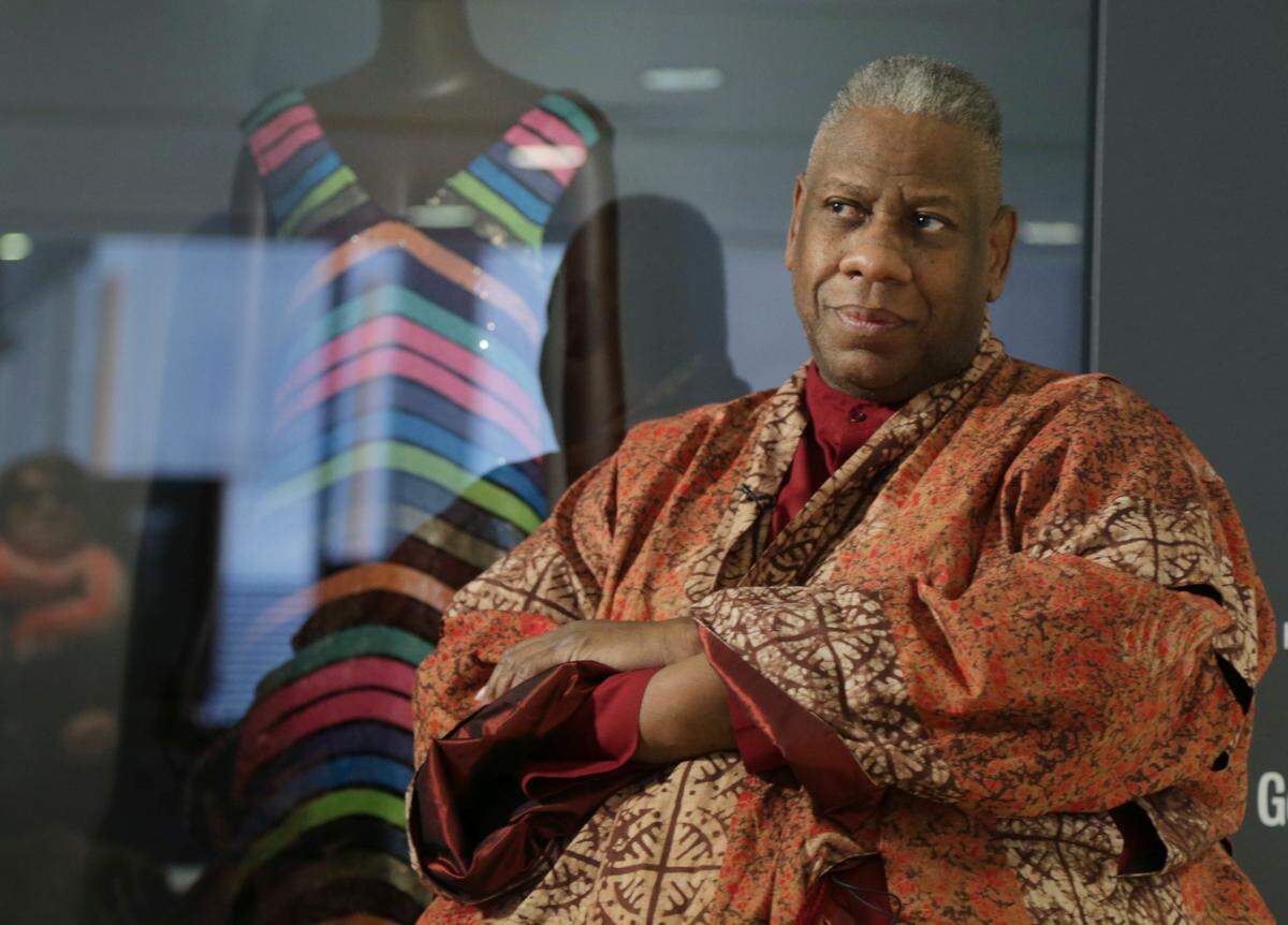 André Leon Talley, a former editor at large for Vogue magazine, speaks to a reporter at the opening of the “Black Fashion Designers” exhibit at the Fashion Institute of Technology in New York, Tuesday, Dec. 6, 2016. Talley, the towering former creative director and editor at large of Vogue magazine, has died. He was 73. Talley’s literary agent confirmed Talley’s death to USA Today late Tuesday, Jan. 18, 2022. (AP Photo/Seth Wenig, File)