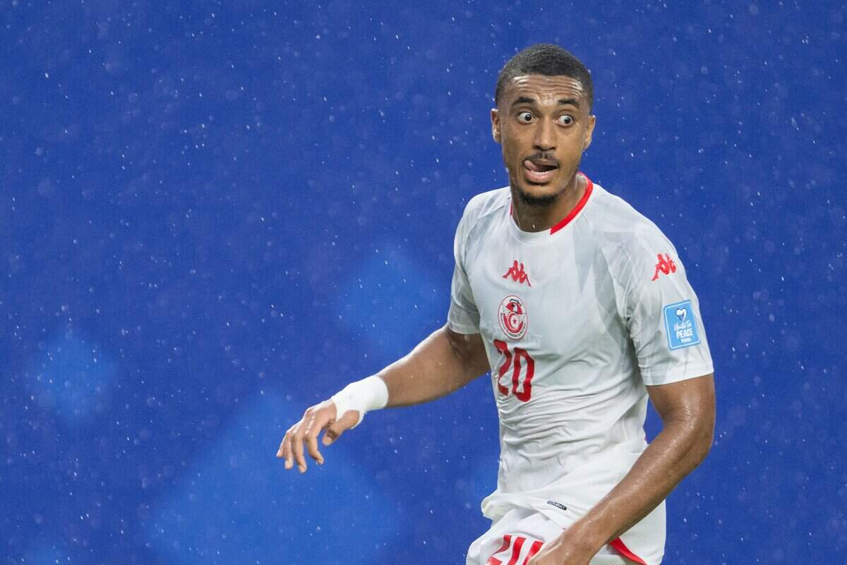 Tunisia defender Yan Valery (20) looks to cross the ball in the rain in a FIFA World Cup group-stage soccer match at Kansas City (Arrowhead) Stadium in Kansas City on Thursday, June 25, 2026.