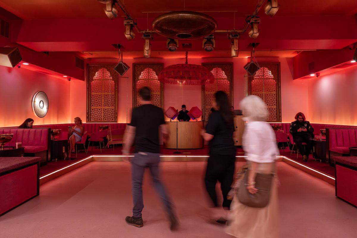 Booths line the space with a DJ booth and dance floor in the center at Laila Lounge on Friday, Aug. 8, 2025, in Kansas City.