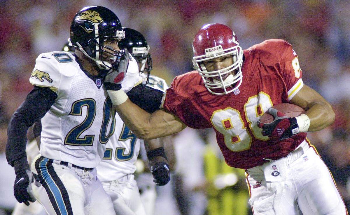 Kansas City Chiefs Tony Gonzalez stiff arms Jacksonville’s Donovin Darius, left on August 19, 2000, during a game against the Jacksonville Jaguars at Arrowhead Stadium.