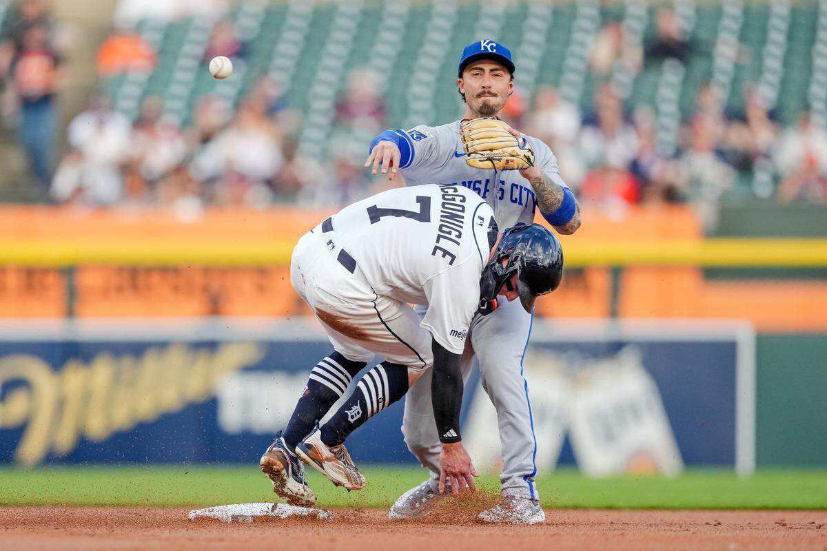 Royals second baseman Jonathan India turns a double play against the Tigers at Comerica Park in Detroit on Tuesday, April 14, 2026.
