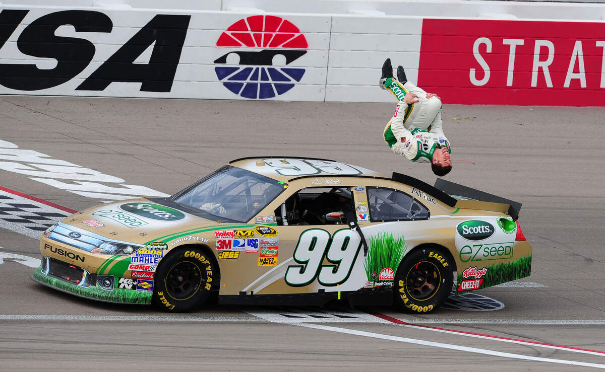 NASCAR Sprint Cup Series driver Carl Edwards celebrates with a backflip after winning the Kobalt Tools 400 at Las Vegas Motor Speedway on March 6, 2011.