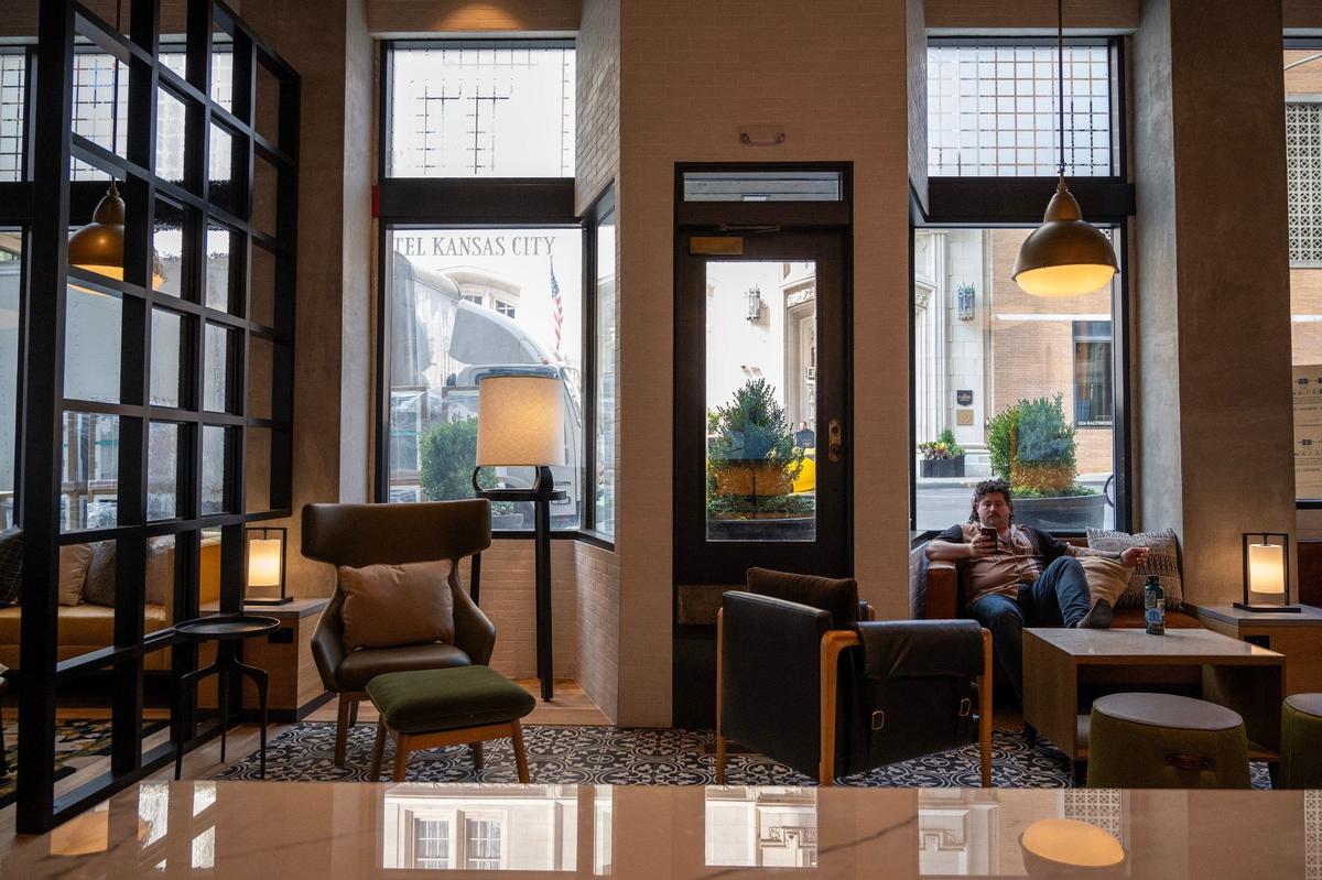 Zachary Karaisz, a resident of the Midland Lofts, lounges in the community space on Thursday.