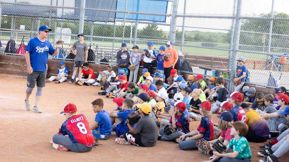 Jeff Sopha, amateur development liaison for the Royals Amateur Development System, talks with players at a free skills camp last year.
