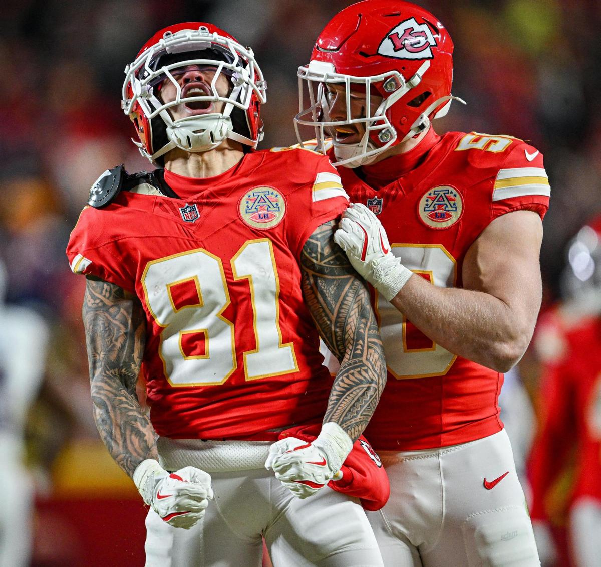 Kansas City Chiefs wide receiver Nikko Remigio (81) celebrates with linebacker Swayze Bozeman (50) after running pack a punt 44 yards in the second quarter against the Buffalo Bills during the AFC Championship Game on Sunday, Jan. 26, 2025, at GEHA Field at Arrowhead Stadium.