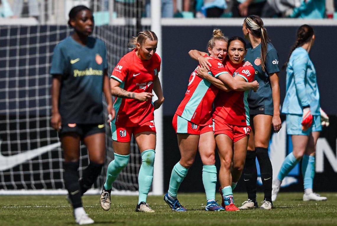 Kansas City Current midfielder Lo’eau LaBonta (10) hugs midfielder Kristen Hamilton after Hamilton kicked in a goal against the Portland Thorns during the home opener for the Current Saturday, March 16, 2024 at CPKC Stadium.