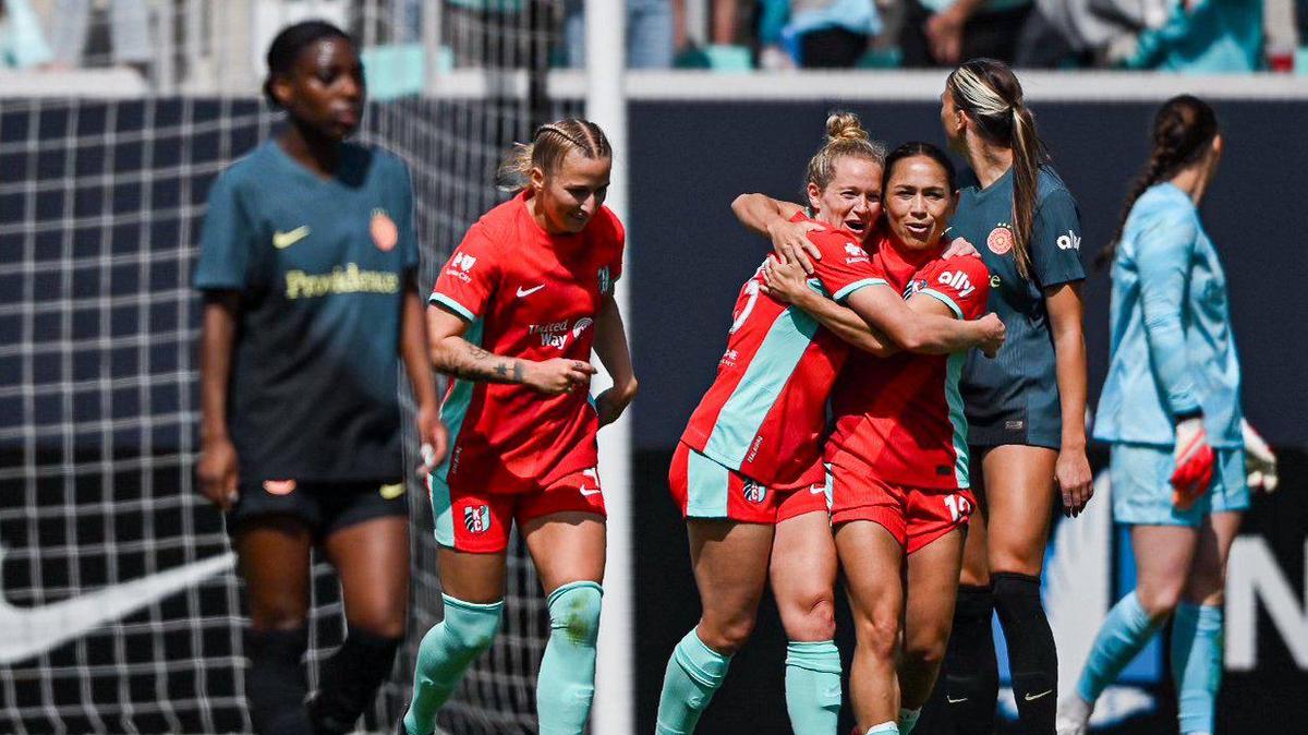 Kansas City Current midfielder Lo’eau LaBonta (10) hugs midfielder Kristen Hamilton after Hamilton scored a goal against the Portland Thorns during the home opener for the Current Saturday, March 16, 2024 at CPKC Stadium.