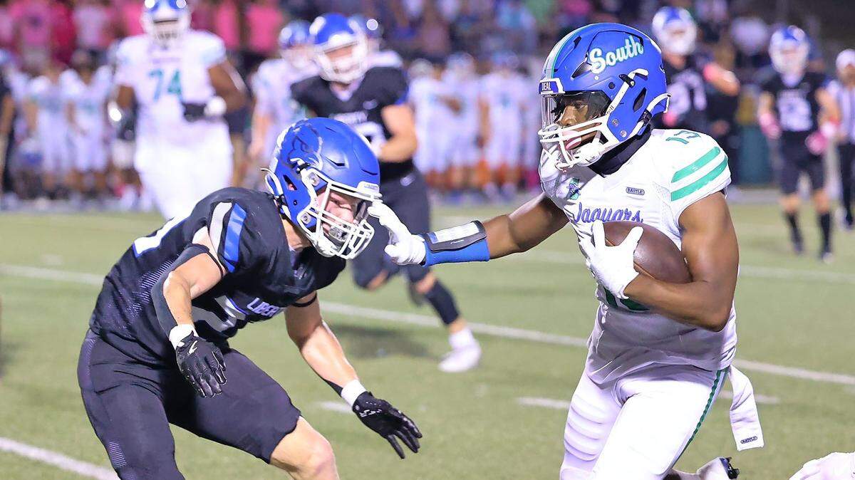 Cam Riley of Blue Springs South fends off a Liberty tackler during the Jaguars’ win on Friday night.