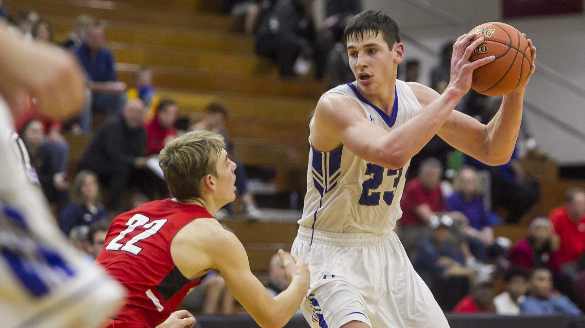 Liberty senior guard Grant Stubbs (right) attempts to maneuver past the defense of Park Hill junior guard Drew Townsend during the Holiday Classic Saturday at William Jewell College.