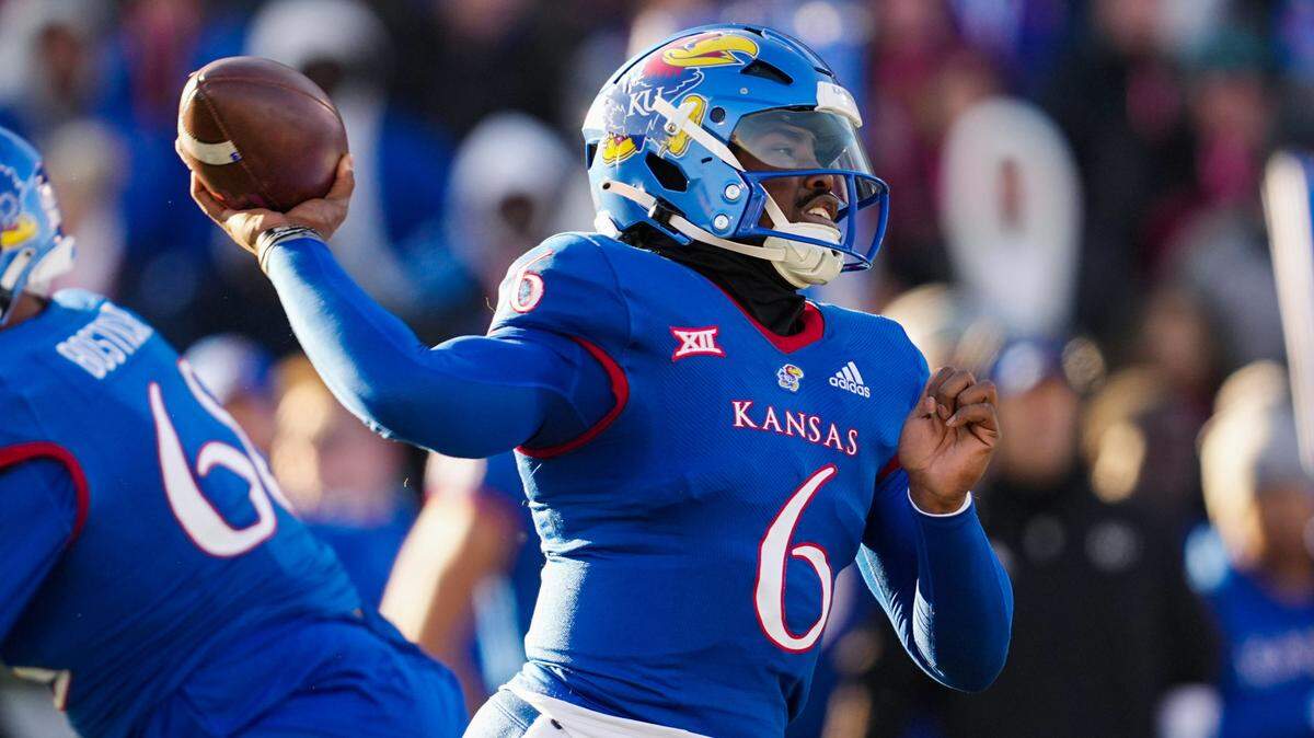 Kansas Jayhawks quarterback Jalon Daniels (6) throws a pass during the first half against the Texas Longhorns at David Booth Kansas Memorial Stadium on Nov. 19, 2022.