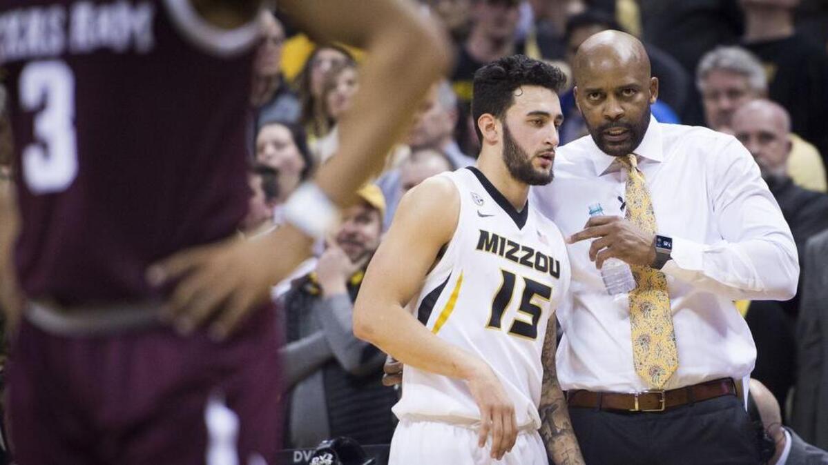 Missouri Tigers head coach Cuonzo Martin talked with Missouri Tigers guard Jordan Geist (15) on the sideline in the second half during the University of Missouri and Texas A&M University Southeastern Conference basketball game at Mizzou Arena on Tuesday, February 13, 2018, in Columbia, Missouri. Missouri beat A&M 62-58.