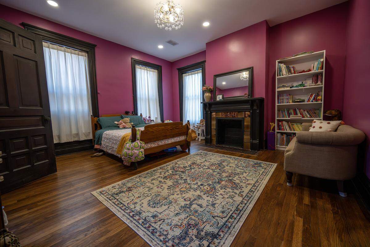 Pink walls adorn an upstairs bedroom at the Bezanson family home on Wednesday, April 8, 2026, in Kansas City.