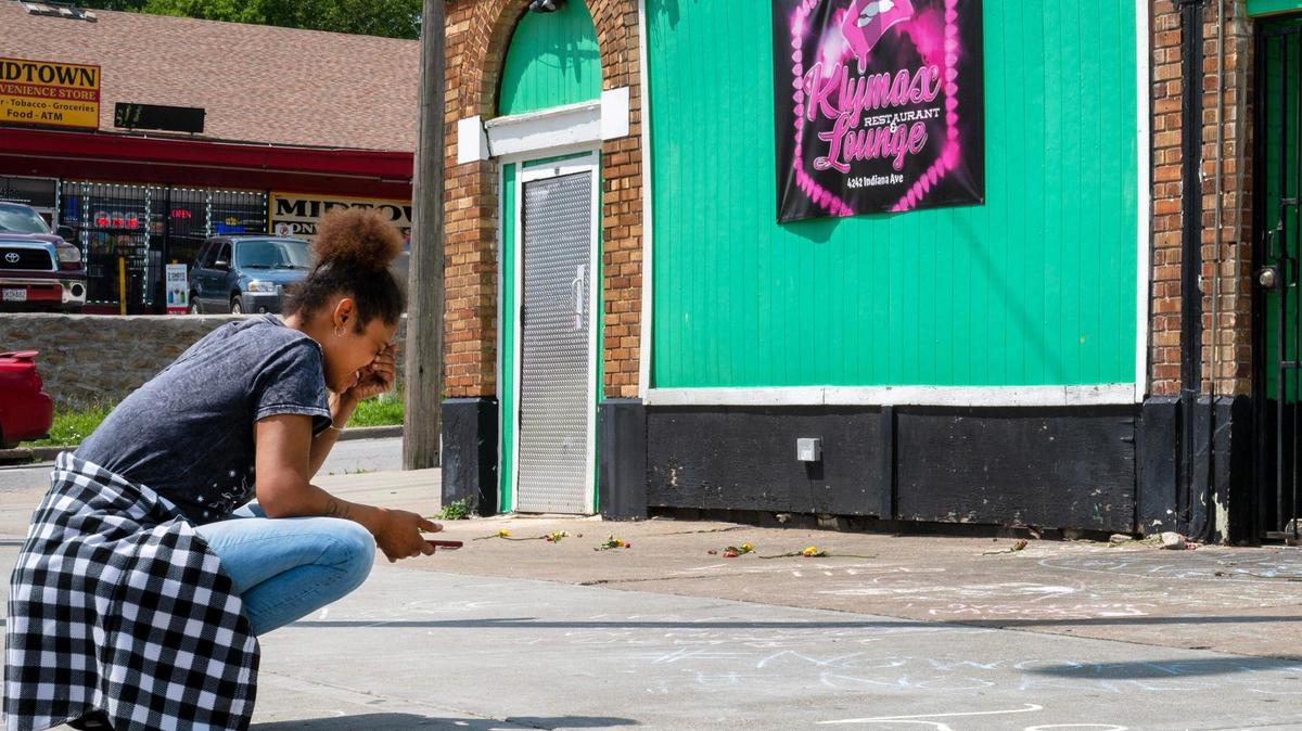 Desionee Smith, mourns the loss of her cousin, Antoinette “Libby” Brenson, outside Klymax Lounge on Monday, May 22, 2023, in Kansas City. Brenson was one of the three victims who were fatally shot at Klymax Lounge early Sunday.