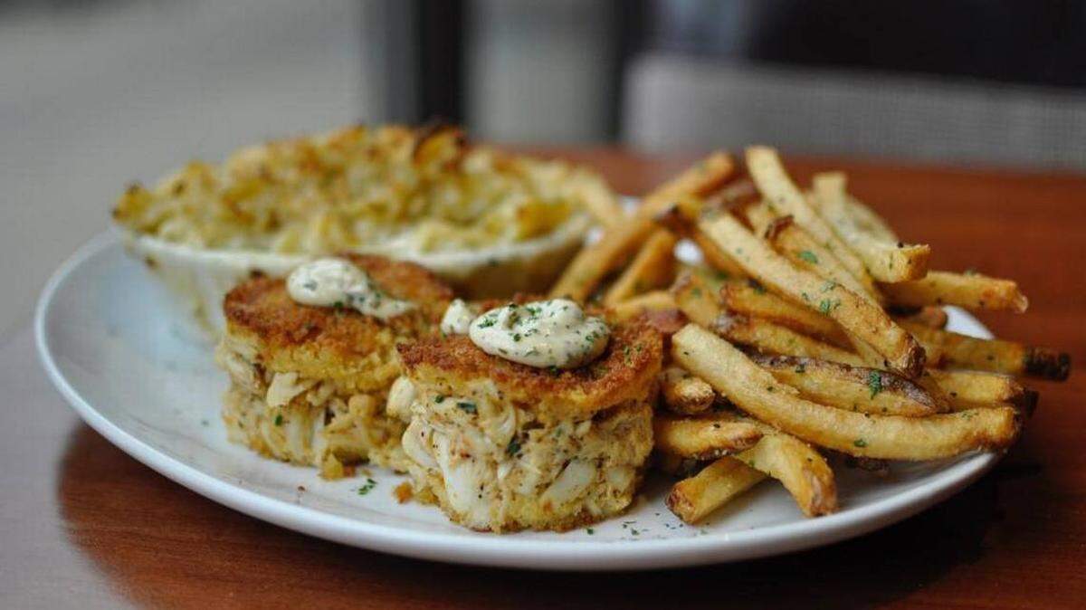The Grille at Park Place’s jumbo lump crab cakes entree comes with two sides, such as gourmet mac and cheese and hand-cut fries.